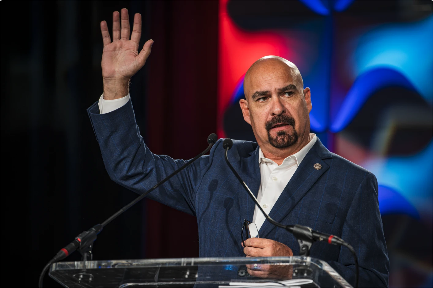 Roland Martinez speaking at a podium
